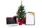 decorated christmas tree, computer and gift list on white background