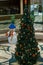 Decorated Christmas tree with a snowman in a blue bowler hat