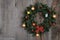 Decorated christmas wreath on barn board