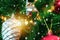 Decorated closed up Christmas tree on blurred, sparkling snowing and fairy abstract background of holiday lights