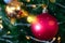 Decorated closed up Christmas tree on blurred, sparkling snowing and fairy abstract background of holiday lights