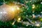 Decorated closed up Christmas tree on blurred, sparkling snowing and fairy abstract background of holiday lights