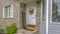 Decorated doorway and reflective windows of a home