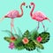 Decorated with exotic rain forest jungle palm tree monstera leaves and couple of pink flamingo birds