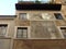 Decorated facade of an ancient building  of Rome in Italy.