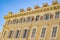 Decorated facade of a historic house in Nice, France. You can see the typical windows and shutters of a Mediterranean c