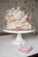 Decorated with fresh flowers, white naked cake, a stylish cake for weddings, birthdays and events