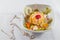 Decorated fruit salad bowl and necklace composition