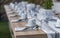 Decorated garden table set with epty coffecups and unused water glasses