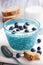 Decorated glass bowl of blueberries