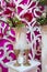 Decorated glasses and a bouquet on a table