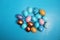 Decorated golden and blue easter eggs on a dark blue background. Minimal holiday concept. Happy easter background. Creative