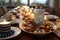 Decorated Hanukkah table with candles, gelt, cookies and festive blue and white decorations