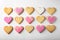 Decorated heart shaped cookies on white background