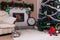 Decorated holiday home decor with fireplace and Christmas tree