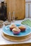 Decorated homemade muffins on a blue plate