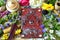 Decorated magic book, quill, summer herbs and flowers on witch table