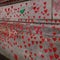 Decorated National Covid memorial wall with painted hearts in London Lambeth