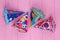 Decorated party hats on color background.