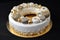 decorated ring cake with sprinkle of gold and silver dragees