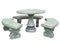 Decorated stone garden furniture table and chairs isolated over white