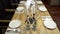 Decorated table for home holiday feast. Action. Evening feast with simple served table in home furnishings for