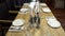 Decorated table for home holiday feast. Action. Evening feast with simple served table in home furnishings for