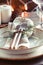 Decorated Thanksgiving or New Year table setting among white candles and winter decor