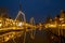 Decorated traditional boats in the harbor from Dokkum in Netherlands at christmas at night