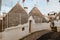 `Decorated Trulli Houses on a sunny day