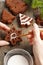 Decorating christmas gingerbread chocolate cookies with white icing