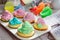Decorating delicious muffins with cream and decoration