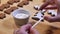 Decorating freshly baked home-made Christmas gingerbread cookies