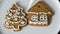 Decorating holiday gingerbread cookie. Pastry bag with white icing. Making handmade festive new cookies for gift in