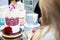 Decorating tiered wedding cake by brush with colour