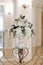 Decoration of artificial flowers in a vase in a ceremonial hall at a wedding ceremony, a close-up detail, a stand or a