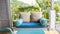 Decoration with blue string swing with a pillow on a patio and wooden deck in the garden mountain background