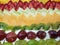 decoration of a cake with slices of various fruits, background and texture