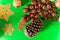 decoration christmas with green background with chestnuts and pine cones. christmas and new year concept