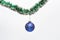 Decoration for Christmas tree hang on tinsel. Christmas decorations concept. Ball with ornaments hang on shimmering