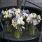 Decoration of dining table. bouquet of white narcissus in vase o