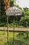 Decoration of Hindu temple complex Batukaru on Bali island in Indonesia. Yellow and white decorative umbrellas line the path for