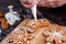 Decoration process of Christmas bakery.Woman hands with icing co