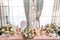 Decoration of a wedding table of newlyweds, candles, candlestick, fresh flowers.