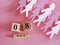 Decoration of wooden date blog cube for 8 March , international women`s day with paper craft women shape on pink for a celebratio