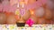 Decorations with balloons and a happy birthday candle with the number 40 for a woman. Happy birthday greetings in pink flowers