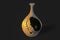 Decorative `amphora with holes` jug on dark grey background