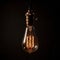 Decorative Antique Retro Edison Light Bulb on Dark Background. Generative ai