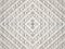 Decorative antique white leather woven panel with abstract centered rhombus pattern