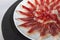 Decorative arrangement of iberian cured ham on plate